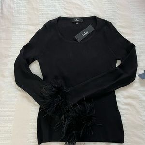 New with tags, lulus black long sleeve top with feather wrists. Size small.
